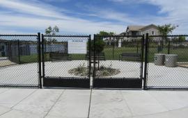 Cyclone Gate Entrance to River Islands Dog Park with Park Rules Posted