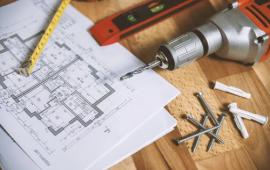 Image of plans and construction tools