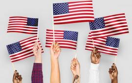 American Flag held by various human hands to express diveristy