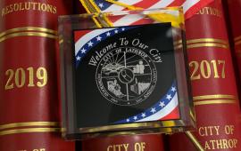Lathrop Municipal Code Books with USA Flag and City Seal Clear Plaque