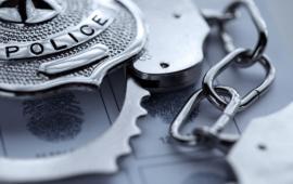 Picture of Police Badge and Handcuff