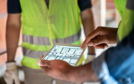 Public Works Engineers looking at plans on a tablet