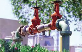 Backflow Device in industrial area surrounded by landscape