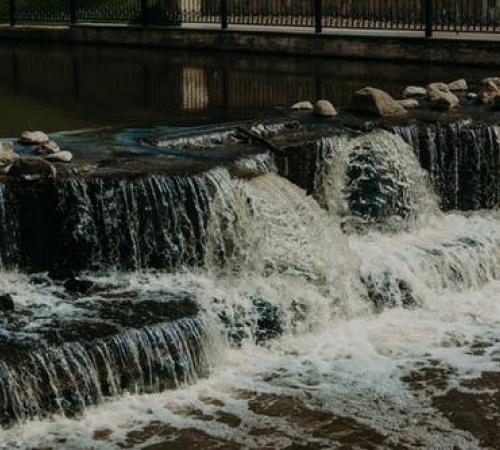 Body of water flooding into canal