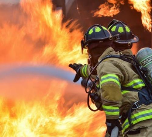 Fire Department staff putting out fire