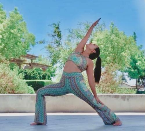 Yoga teacher posing in Valverde Park.