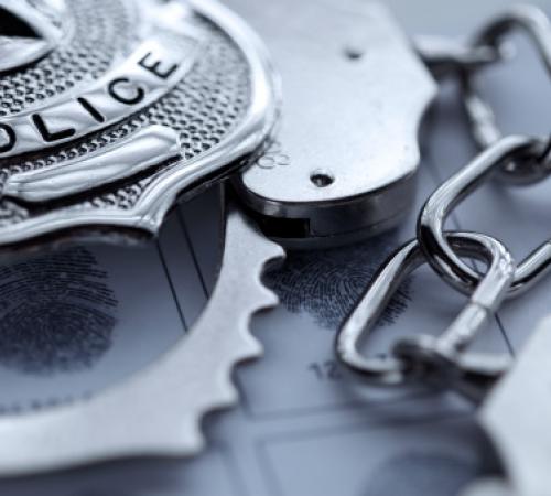 Picture of Police Badge and Handcuff