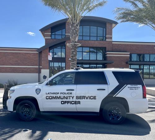 Community Services Officer vehicle parked in front of the Lathrop Police building.