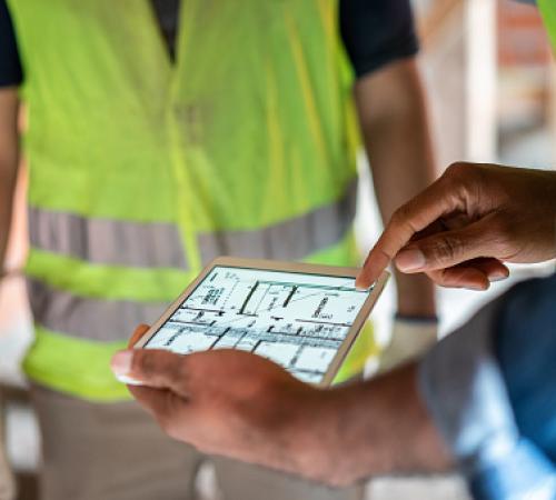 Public Works Engineers looking at plans on a tablet