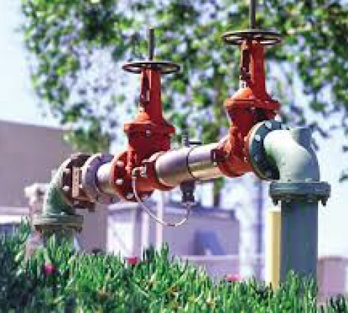 Backflow Device in industrial area surrounded by landscape
