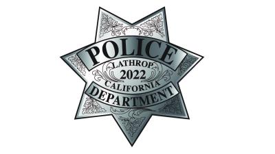 Lathrop Police Badge, 7 point silver star with black writing of "Police Department, Lathrop 2022 California"