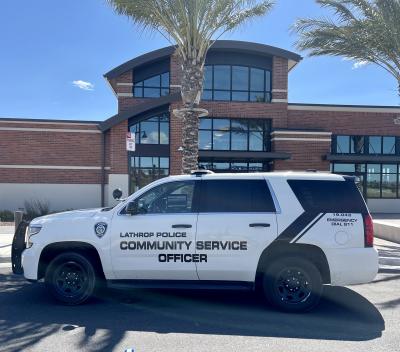 Community Services Officer vehicle parked in front of the Lathrop Police building.
