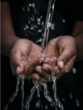 Hands under running water