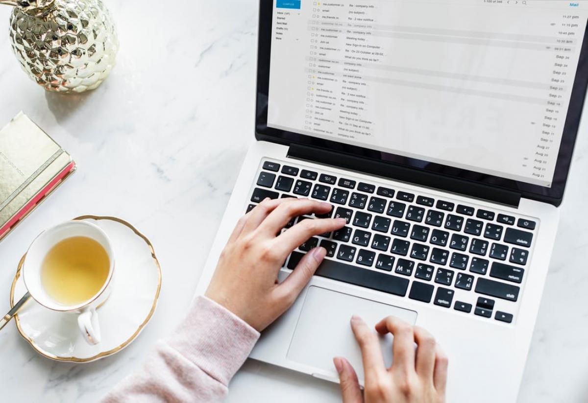 person on laptop and tea