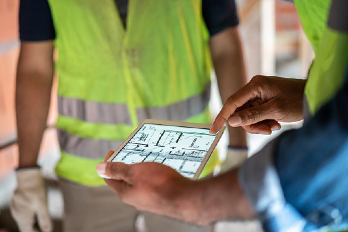 Public Works Engineers looking at plans on a tablet