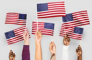American Flag held by various human hands to express diveristy