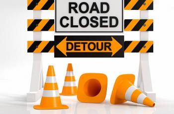 Road Closure and Detour Sign with Orange Cones